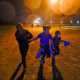 Young migrants hold hands as they run in the rain at an intake area after turning themselves in upon crossing the U.S.-Mexico border in Roma, Texas, in 2021.