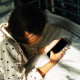 Portrait of a person with mobile phone in hand