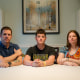From left, Nick, Jonathan, and Misty Benz-Bushling sit at their kitchen table to pose for a photo
