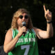 Sean Feucht raises his hand as he speaks.