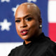 Ayanna Pressley speaks at a podium with an American flag backdrop
