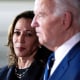 Kamala Harris, left, looks at Joe Biden as they stand next to each other