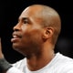 Jason Collins prepares to throw a basketball