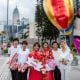 Three couples stand together outside
