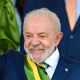 Luiz Inacio Lula da Silva smiles as he waves