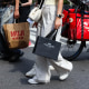 Pedestrians carry shopping bags in New York, on Sept. 6, 2025. 