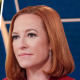 A split composite of life size puppets of Russian political leaders and Jen Psaki.