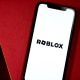 Roblox logo on phone screen