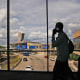 Passengers walk from a terminal at Philadelphia International Airport in Philadelphia, Tuesday, Oct. 7, 2025. 