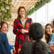 Senior businesswoman giving speech at business conference