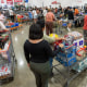 Shoppers wait to check out inside a Costco store