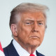 Donald Trump stands outside