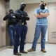 Federal agents patrol the halls of immigration court at the Jacob K. Javitz Federal Building.