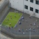 Detainees exercise in an outdoor recreation area at the Northwest ICE Processing Center on May 2, 2025 in Tacoma, Wash.