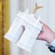 US President Donald Trump holds a model of the planned Triumph Arch.