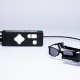 Glasses connected to a remote, laid on a white surface