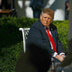 President Donald Trump listens to a speaker at a "Rose Garden Club" lunch at the White House on Oct. 21, 2025.