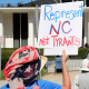 Demonstrators approach the Legislative Building during a rally protesting a proposed election redistricting map on Tuesday.