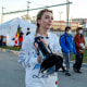 Kat Abughazaleh holds a megaphone outside of the Broadview ICE processing facility.