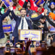 New York City mayoral candidate Zohran Mamdani holds hands with U.S. Senator Bernie Sanders and Rep. Alexandria Ocasio-Cortez.