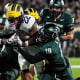 It wasn't always pretty, but Michigan was able to ride big games from Justice Haynes and Jordan Marshall to knock off in-state rival Michigan State and retain the Paul Bunyan Trophy.