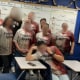 Teachers from the Vail School District in Pima County, Arizona, were photographed in 2024 wearing shirts that read “Problem Solved” with a fake blood graphic.