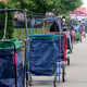 Carts lined up to reserve people’s places in line for meals.