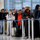 People wait in a security checkpoint line at George Bush Intercontinental Airport in Houston, Texas, on Tuesday, Nov. 4. 