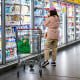 Jen Psaki; A customer shops for produce at a grocery store.