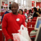 Employees ring customers up at cash registers inside a Target store in Jersey City, N.J.