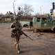 Ukrainian serviceman walks on a street in the frontline town of Kostiantynivka