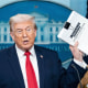 President Donald Trump holds a stack of papers labeled ''The White House Accomplishments'' as he arrives for a press briefing at the White House on Jan. 20, 2026.