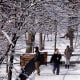 People walk along the snow-covered bridge on the Riverway in Boston, MA. on Monday.