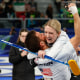 Cory Thiesse, right, and Korey Dropkin celebrate at the end of the curling mixed doubles round robin semi-final between USA and Italy during the Milano Cortina 2026 Winter Olympic Games at the Cortina Curling Olympic Stadium in Cortina d'Ampezzo on February 9, 2026. 