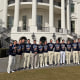 The U.S. men's hockey team poses with their gold medals at the White House on Feb. 24, 2026.