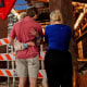 People pay homage to the shooting victims at a makeshift memorial outside of Buford's bar in on March 2, 2026 in Austin, Texas.