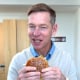 McDonald's CEO Chris Kempczinski tries the fast-food giant's new Big Arch burger.