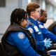TSA agents seated at their stations