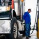 A man refills his diesel truck.
