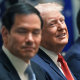 President Donald Trump is flanked by Secretary of State Marco Rubio, left, and Defense Secretary Pete Hegseth during a Cabinet meeting 