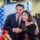 Former television actor Dean Cain poses with an attendee at CPAC in Grapevine, Texas on March 26, 2026.