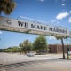 A car drives under a sign that states the sole purpose of the Marine Corps Recruiting Depot, Wednesday, May 11, 2022, in Parris Island, SC. The recruiting depot at Parris Island is one of only two in the United States, the other is the Marine Corps Recruiting Depot San Diego.