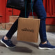 A shopper carries an Allbirds bag in New York in 2019. 