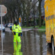 A worker with the Milwaukee Department of Public Works unclogs a storm drain.