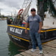 Wilmer Ruiz next to shrimp boat