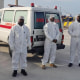 Medical workers await three people evacuated from the MV Hondius cruise ship in Cape Verde on May 6, 2026.