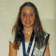 Stephanie Davis as a child, wearing the sash from the Assemblies of God's Missionettes girls program; Refuge Church of The Assemblies of God in Jonesboro, Ark.