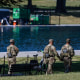 U.S. Army National Guard patrols as visitors walk along the Lincoln Memorial Reflecting Pool.