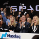 Bret Johnsen, chief financial officer of SpaceX, center, and Spacex President Gwynne Shotwell, center right, during the company's initial public offering at the Nasdaq MarketSite in New York on Friday, June 12, 2026.