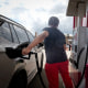 Motorists pump gas